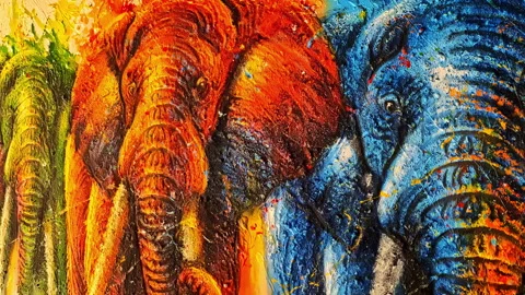 Close-Up of Red, Yellow, and Blue Elephant Mural Art Stock Footage 308527323
