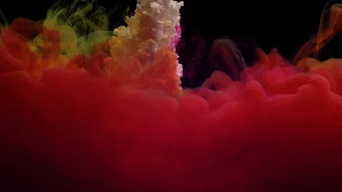 Close-up of red, yellow, white, orange and pink paint sprayed into water Stock Footage 114320908