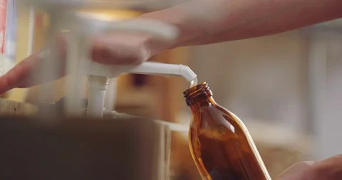 Close Up Of Refilling Glass Bottle With Soap In Sustainable Zero Waste Store Stock Footage 206773083