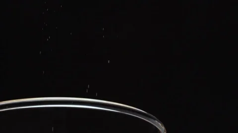 Close up of refined white cake flour falling on a black background Stock Footage 72471767