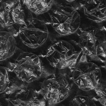 Close up of reflecting light and shadow on creases and tears in plastic bubble Illustrazione stock