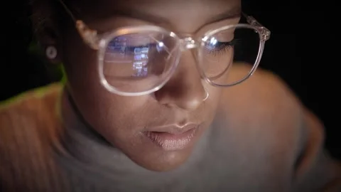Close up of reflection of computer screen on glasses of American woman working Stock-Footage 250422030