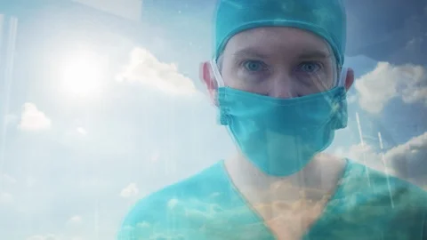 Close up reflection of a doctor looking out of a window Video stock 87017083