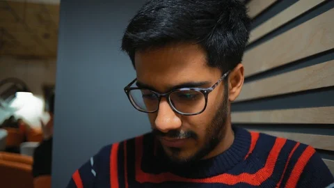 Close-Up, Reflection in Points An Guy Looks at  News Feed on  Smartphone Stock Footage 101659230