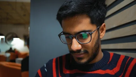 Close-Up, Reflection in Points An Guy Looks at  News Feed on  Smartphone Stock Footage 101659471