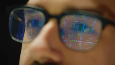 Close up reflection of stock market graphs in broker glasses 스톡 동영상 127969698