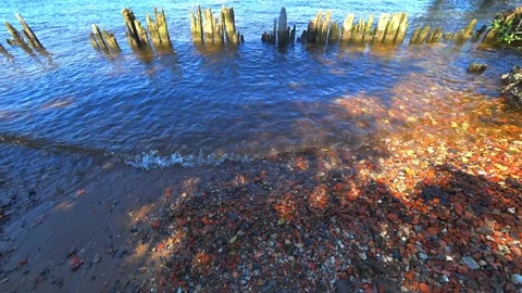 Close up of reflection in the water and cobblestone in the background. Stock Footage 133445840