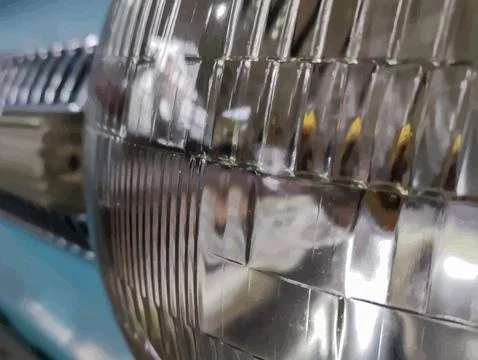 Close Up of a Reflective Car Headlight 库存照片