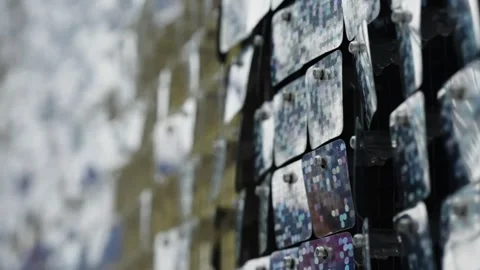 Close-up of a reflective kinetic sequin wall with shimmering square tiles Stock-Footage 327323261