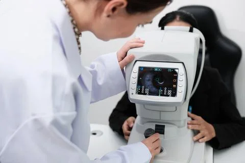 Close-up, refractometer device screen of patient eye exam in optical clinic. Stock Photos