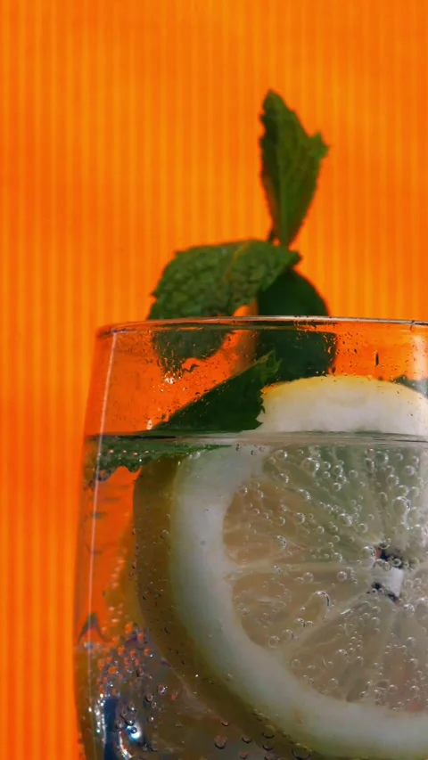 Close-Up of Refreshing Citrus Drink with Mint Video stock 337771998