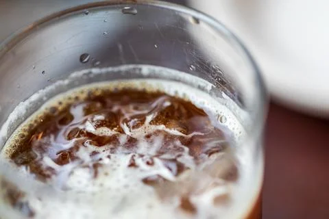 Close-up of the refreshing iced coffee and the ice droplets on the rim of t.. Stock Photos