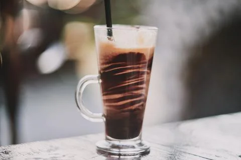 Close-up of a refreshing iced coffee beverage served in a clear glass mug o.. Stock Photos