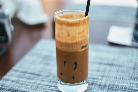 Close-up of a refreshing iced coffee beverage served in a tall glass with a.. Stock Photos
