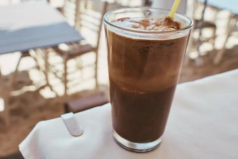 Close-up of a refreshing iced coffee frappe drink served in a tall glass Stock Photos