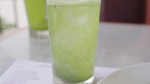 Close up of a refreshing lemon with mint juice, a typical arab drink, fizzing Video stock 340907764