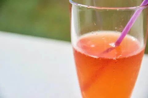Close-up of a refreshing orange spritz cocktail served in a tall glass with.. Stock Photos