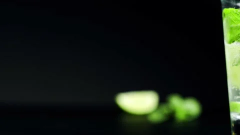 Close-up refreshing soda tonic. Pour carbonated water into a glass of lime and Stock-Footage 148168817