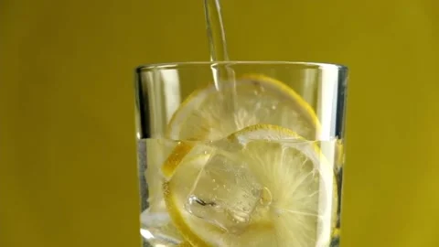 Close-up of a refreshing soda tonic. Pouring sparkling water into a glass Stock Footage 197340132