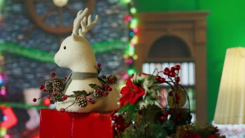 Close up of reindeer toy in empty room decorated with Christmas tree Stock Footage 316642688