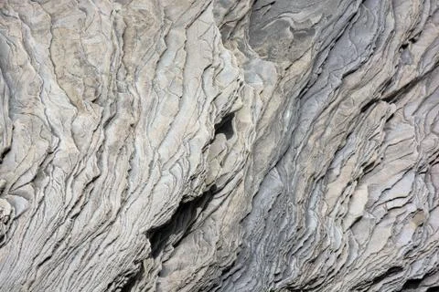 The close-up relief of the grey stone layers Stock Photos