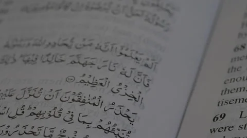 Close up of religious quran scriptures written on pages in church Stock Footage 208764719