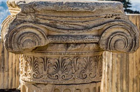 Close-up of the remains of the column with its Ionic capital with scrolls and Stock Photos