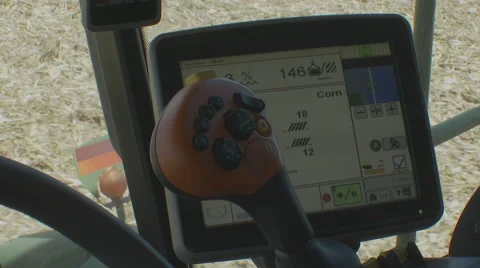 Close of remote control in a corn combine as harvest is underway, 4K. Stock Footage 68826442
