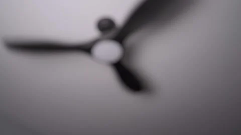 Close up of remote turning ceiling fan off Stock Footage 342348182