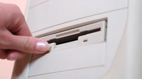 Close up of removable floppy disk by hand in vintage pc. The drive for reading 스톡 동영상 195165018