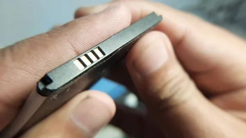 Close Up of Removable Vintage Cellphone Lithium Ion Battery Stock Footage 341372164