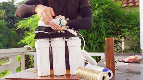 Close Up Removal of Old Reverse Osmosis Membrane Filter From Water Purification Stock Footage 335235080