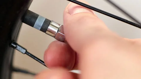 Close up remove the lid from the Bicycle wheel. Macro shot 스톡 동영상 130823743