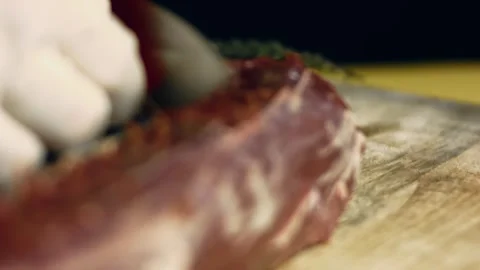Close up of removing the silver skin from beef tenderloin using a sharp knife Stock Footage 329357205