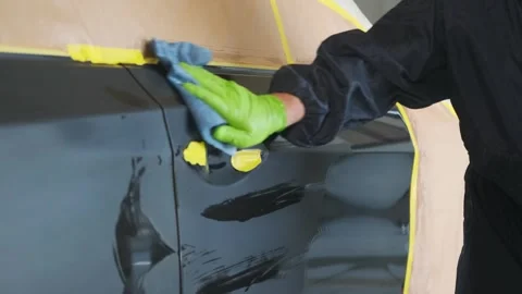 Close-up of repaired vehicle door with sanding marks and body filler during Stock Footage 334861570