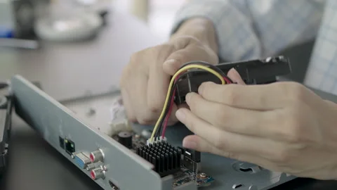 Close-up, Repairing or installing hard disk into a security camera recorder. 스톡 동영상 332696368