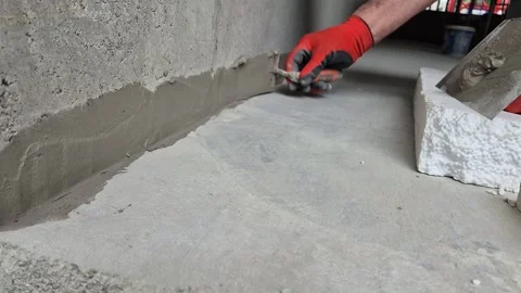 Close Up of Repairing Wall with Waterproof Cement Mortar Stock Footage 338192105
