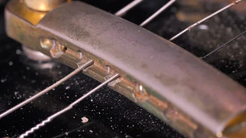 Close-up of replacing the strings on an electric guitar Stock Footage 330868071