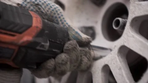 Close-up of replacing a wheel with an electric wrench. Footage. Live footage 스톡 동영상 145522916