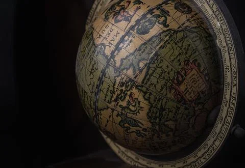 Close-up of Replica Globe or World Globe Map on black background. Stock Photos