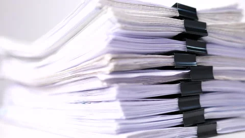 Close-up of report paper stacking of office working document on white table Stock Footage 161614709