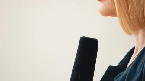 Close-up of a reporter holding a microphone during an interview Stock Footage 320962687