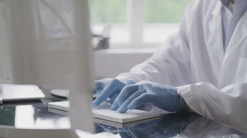 Close up of Research Scientist Entering Test on Laboratory Computer during day Stock Footage 208766424
