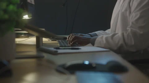 Close-up of Research Scientist Working at His Desk Computer Stock Footage 208775235