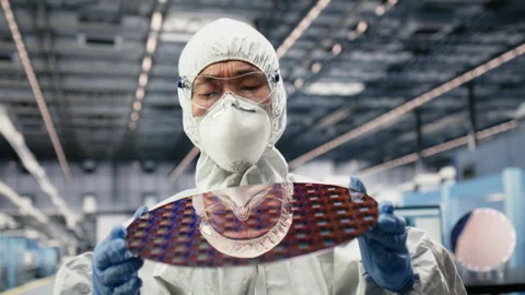Close up of researcher holding processed silicon wafer Stock Footage 333391866