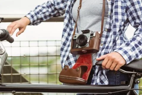 Close up of a retro camera around the neck of the girl Fotos Stock