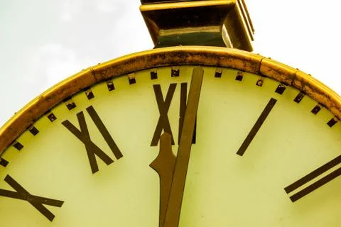 Close up of a retro clock and time is 12 o'clock. Stock Photos