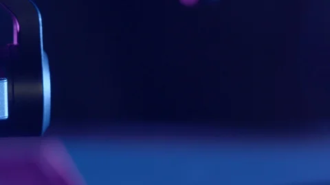 Close-up reveal of drone camera gimbal in purple and blue lighting. DJI Inspire Stock Footage 129288941