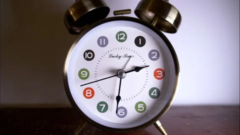 Close-Up Reverse Time-Lapse of a Silver Vintage Alarm Clock Stock Footage 336644055