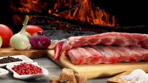 Close-up of the ribs next to ingredients for the preparation of the grilled ribs Stock Footage 149106149